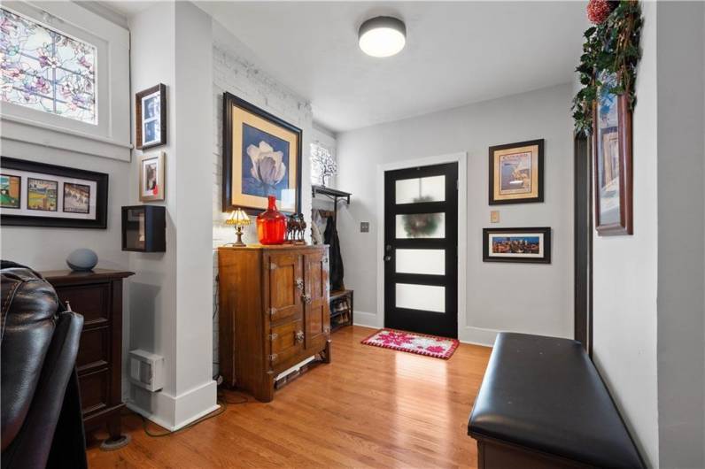 Welcoming entry boasting new gorgeous hardwood floors!