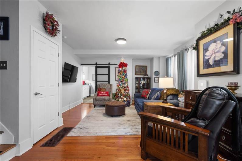 Spacious living room with new hardwood floors.