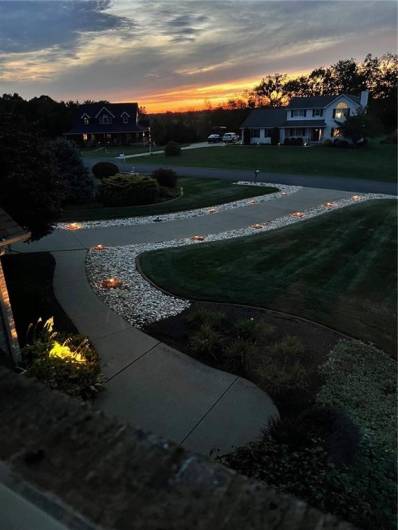 Elegant landscaping and driveway at Sunset