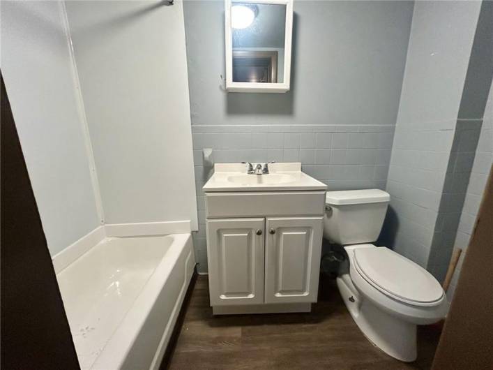 Full bathroom with tub/shower combo.  It is located off of the kitchen on the second floor.