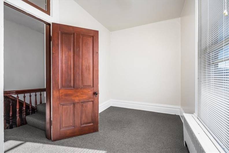 Smaller room would make a great office or walk-in  closet.