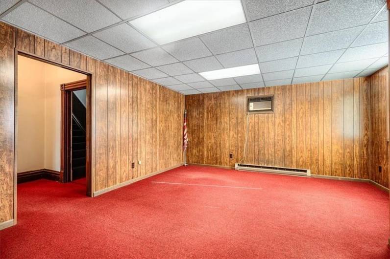 Another view of the living room with baseboard heat.