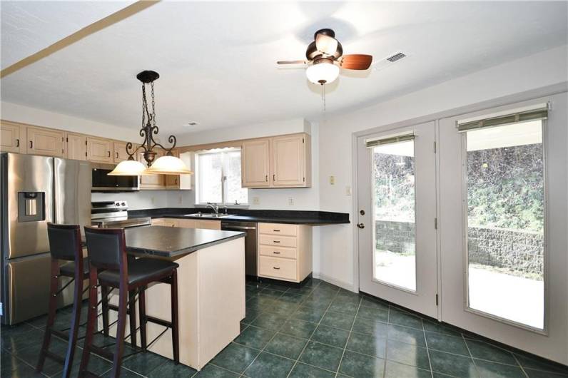 French doors lead to the covered patio! Great for having your morning coffee