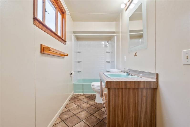 An additional full bath is located upstairs, and has a closet for storage (not pictured)