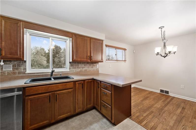 Enjoy the view out the large kitchen window!  So much sunlight!  You'll feel like your outside!