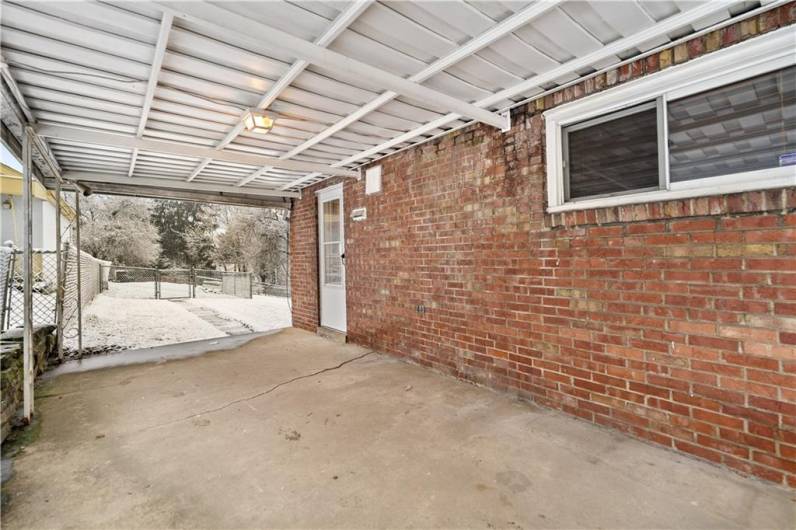 Wonderful oversized covered patio right off the kitchen!  Step outside to grill no matter what the weather!