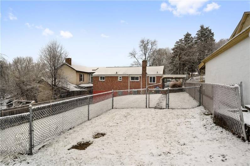 Two parking spaces right off the back street.  You can park and walk right into your covered patio and into the kitchen!