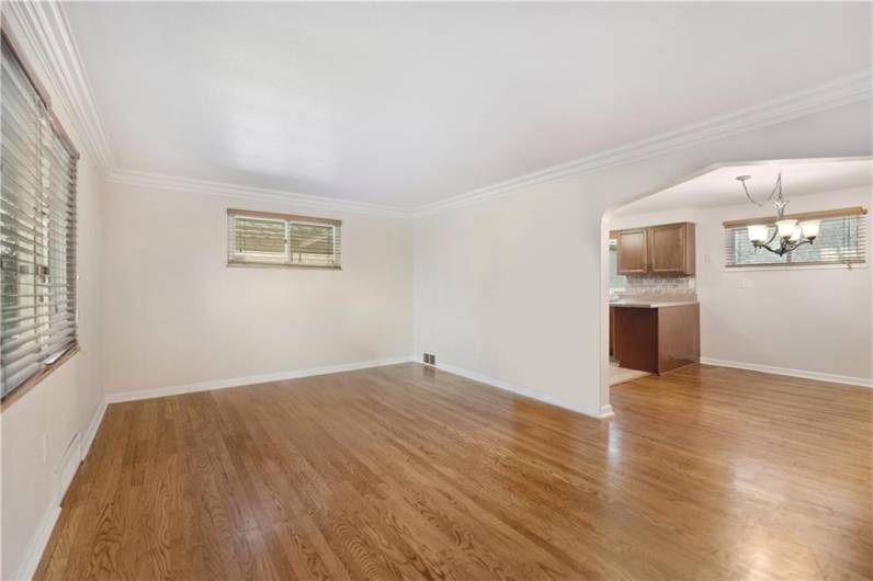 Hardwood floors throughout the main living level.  So much charm!  Fresh neitral paint in Sherwin Williams Aesthetic White.  Everything has been refreshed and professionally cleaned.  Move-in Ready!