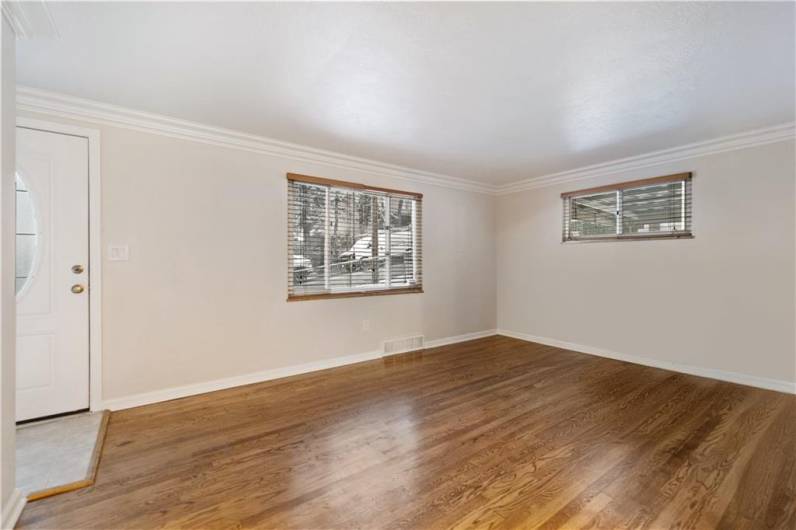 So much natural light! Large windows and hardwood floors.