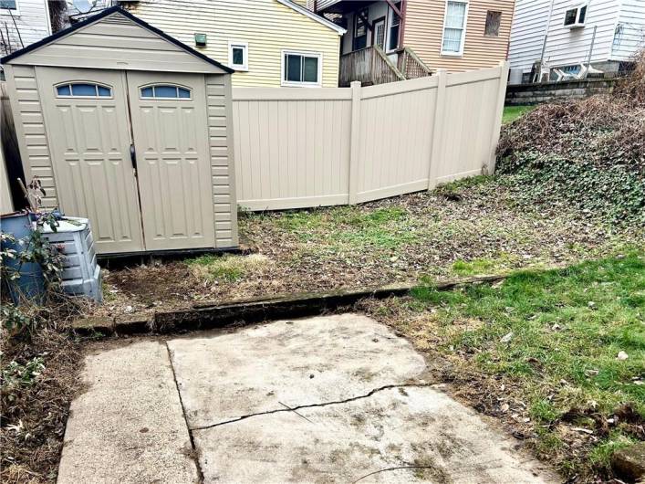 Privacy fence and shed in the back yard plus space for garden and play.