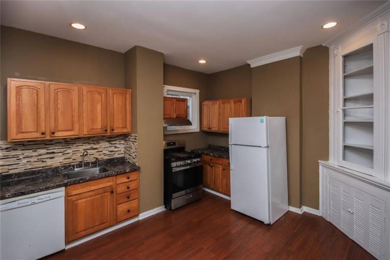 Nice backsplash and many work spaces.