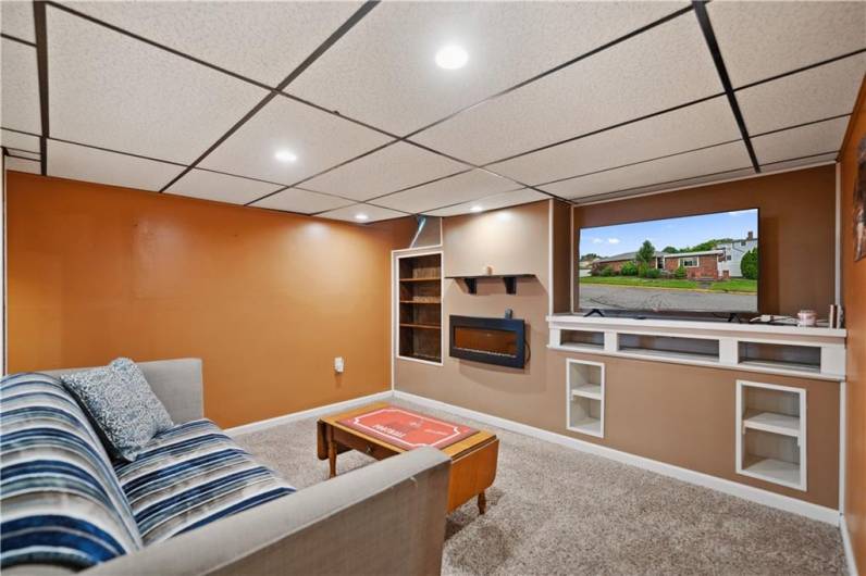 Family Room w/ Fireplace & Built-Ins for Storage