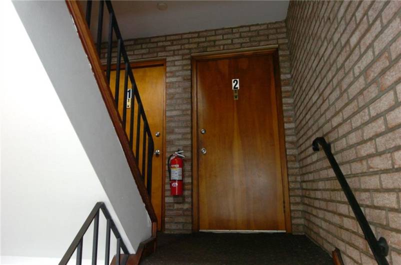 Stairwell to apt 1 and 2 entry doors.