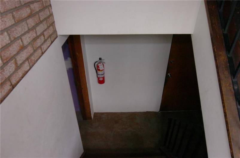 Stairwell to Apt 5 and basement storage area.