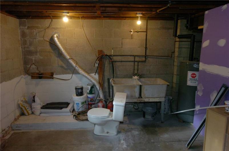 Basement area that could accommodate a washer and dryer