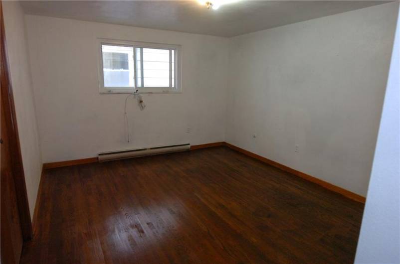 floor in bedroom of apartment 4 recently sanded down and refinished.