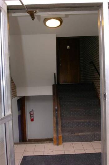 Stairs up and down from entry way.