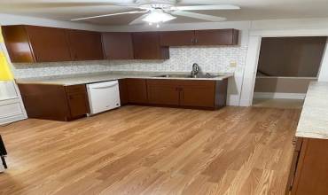 Kitchen - with dishwasher & stove.