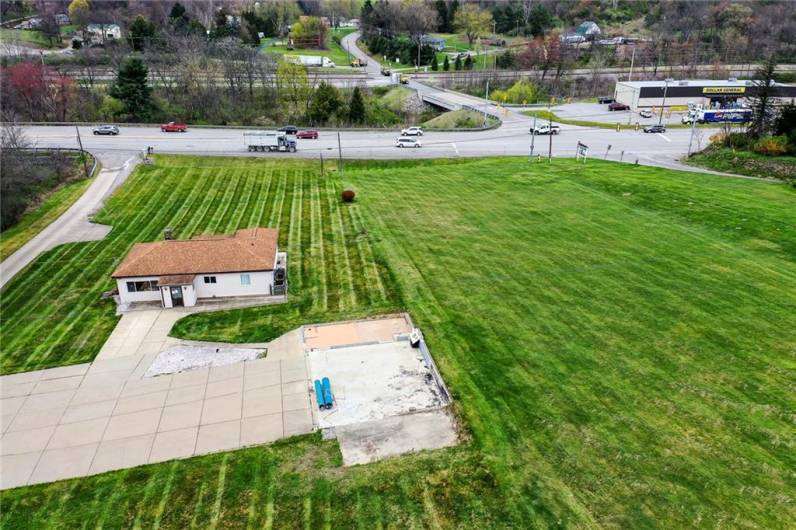 there is a concrete parking pad attached to the existing house