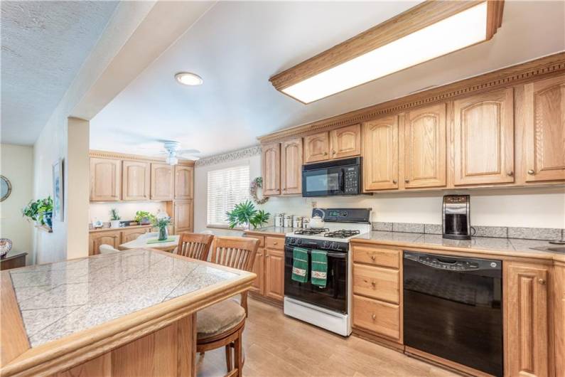 Talk about storage!  There are two walls of cabinetry and the breakfast bar has storage.