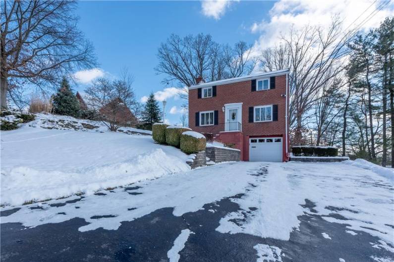 This four bedroom, two full bath and one half bath, has a two car tandem garage and off street parking for at least five more cars.