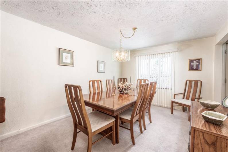 Both the dining room and living room have large picture windows, to let the light in and custom blinds for privacy.