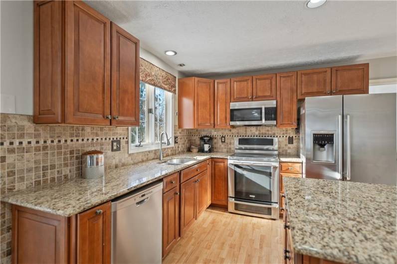 The kitchen is equipped with stainless steel Electrolux appliances.