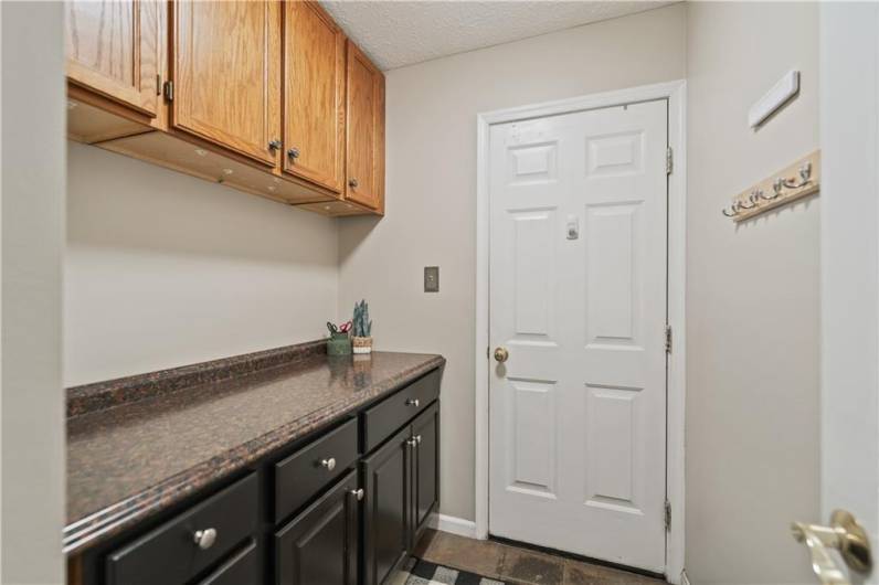 The mudroom is located just inside the door from the attached two-car garage. It could easily be converted into a first-floor laundry room.