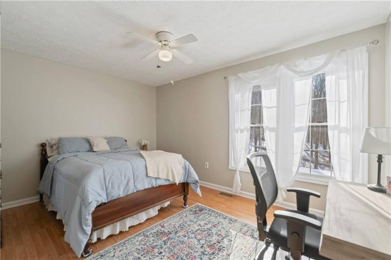 This spacious bedroom overlooks the backyard.