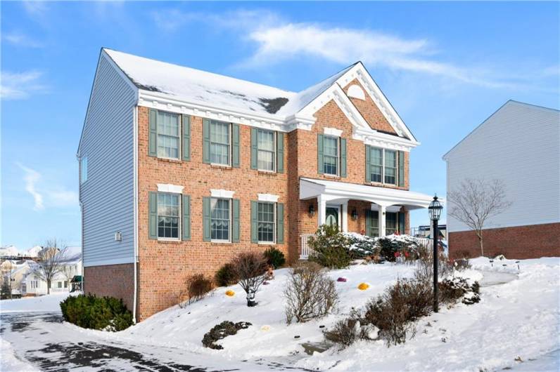 Beautiful brick exterior with covered front porch.