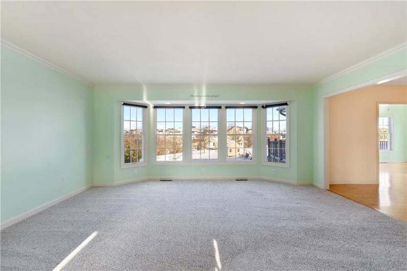 Large living room with a bay window.