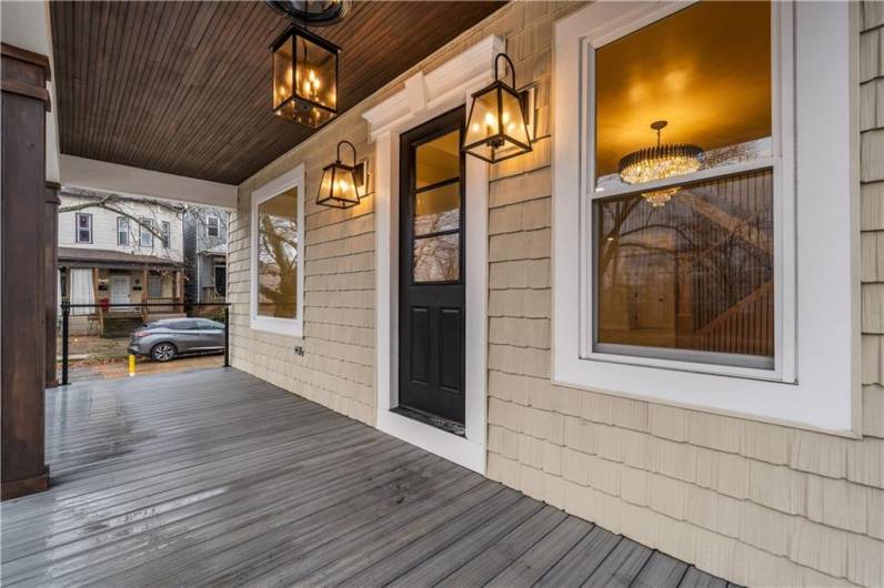 Gorgeous sprawling front porch.  The entrance is grand.  And every time you step up to the dramatic front door with black detailed hardware, you'll pinch yourself that this is you home!