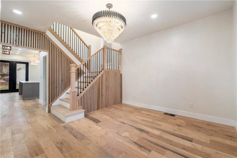 Look at that chandelier.  It's especially gorgeous at night when the lights are dimmed and your ceiling has one thousand points of light radiating from this luxury chandelier.  Your entryway is stunning!