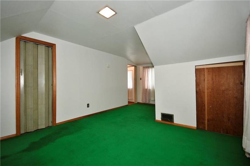 Another view of the bedroom and the closet off to the right.