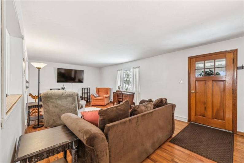 large livening room with hardwood floors