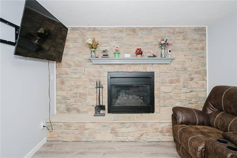 den/family room stone gas fireplace