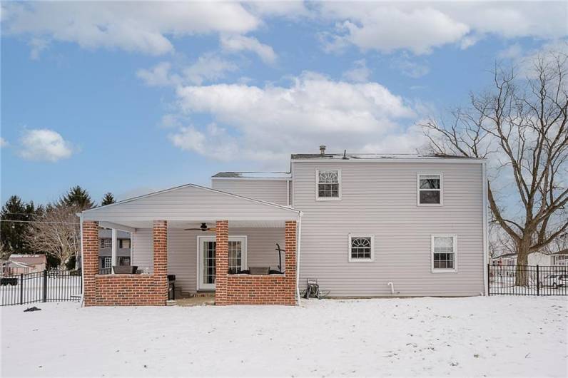 covered, partially enclosed rear patio