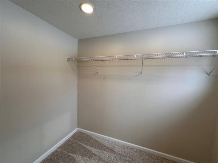 Wall on the left is spacious for a dresser to be inside the closet.