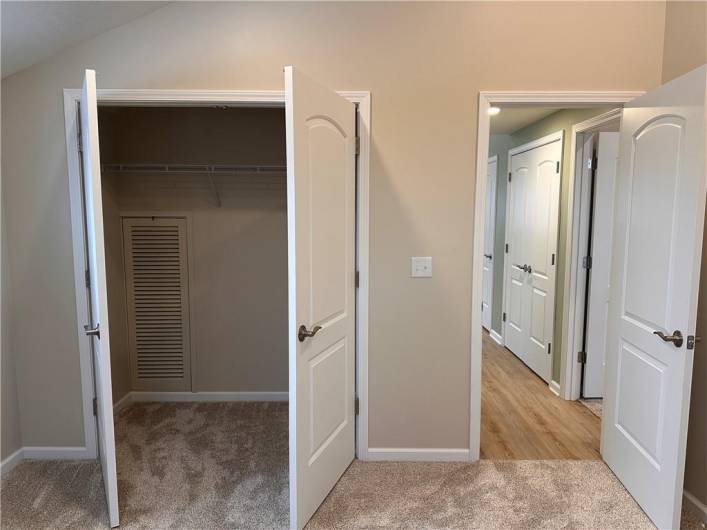 Front bedroom with big closet and bath access panel .