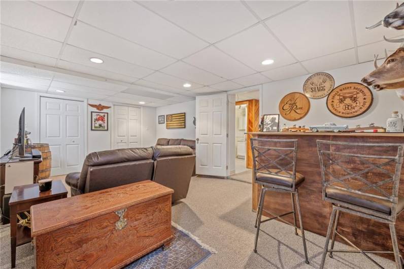 Basement man cave with bar.