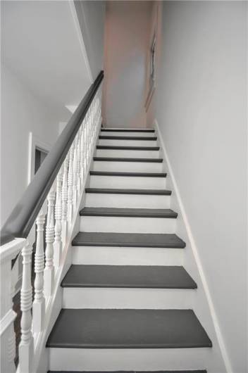 Stair Leading Up To Three Bedrooms And Full Bath