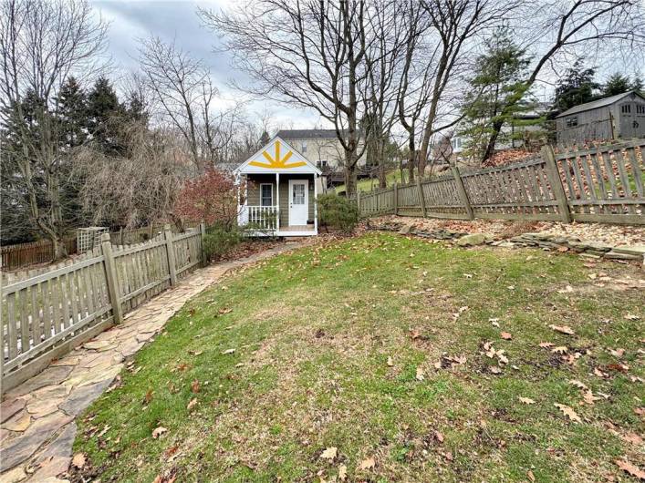 Stone walkway to rear shed.