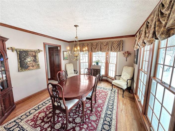 Hardwood floors continue to the dining room featuring a bay window.