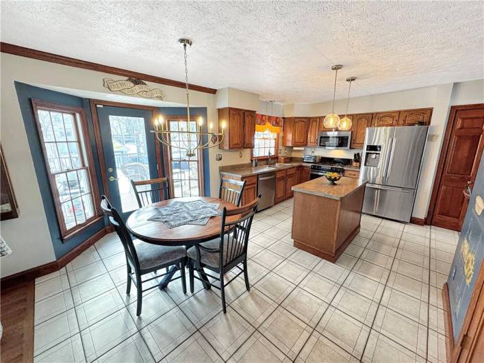 Large kitchen includes a center island and all appliances.