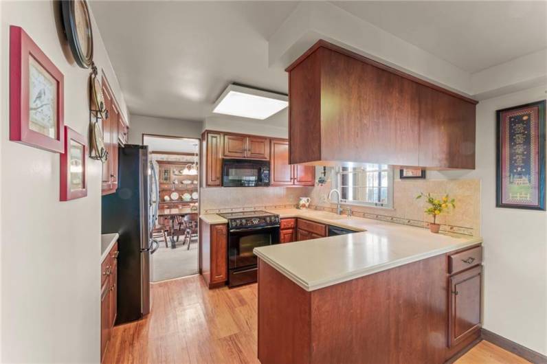 Quality wood cabinetry and Corian countertops surround this lovely kitchen.  All appliances included!