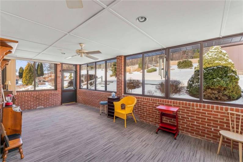 Enjoy the outdoors while being comfortable indoors when sitting in this very large Sun Room. Recessed lighting, ceiling fans, sliding windows with screens and brand new carpeting are just a few of the noteworthy features of this room.