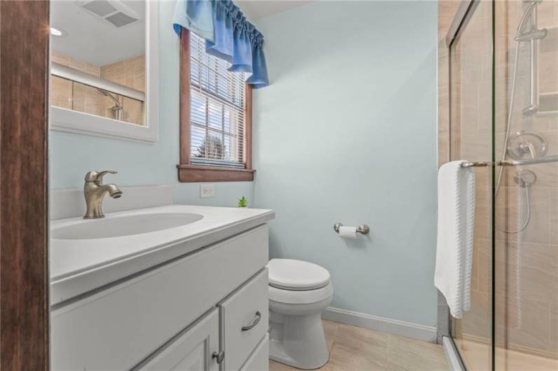 The Master Bathroom has been updated and features an oversized tiled walk-in shower!