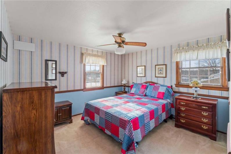 The second of 3 bedrooms on the upper level is spacious and has a large closet.