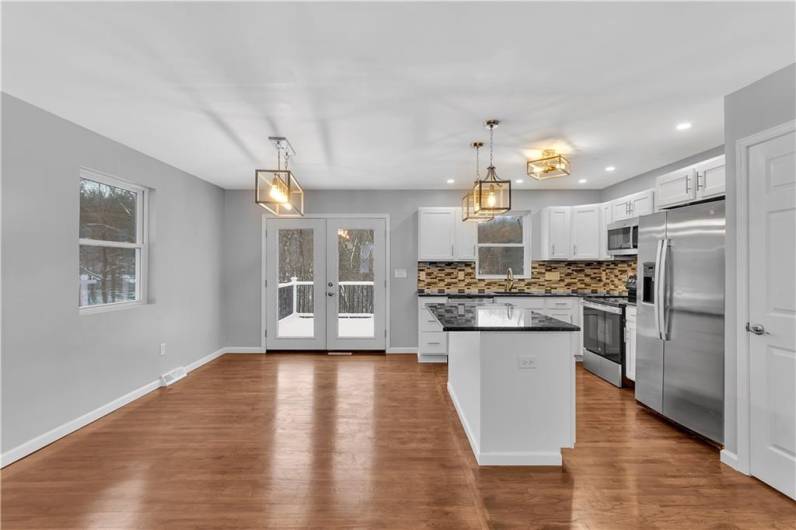 Open Dining Room Great for Entertaining with Breakfast Bar / Island Connecting the Kitchen.