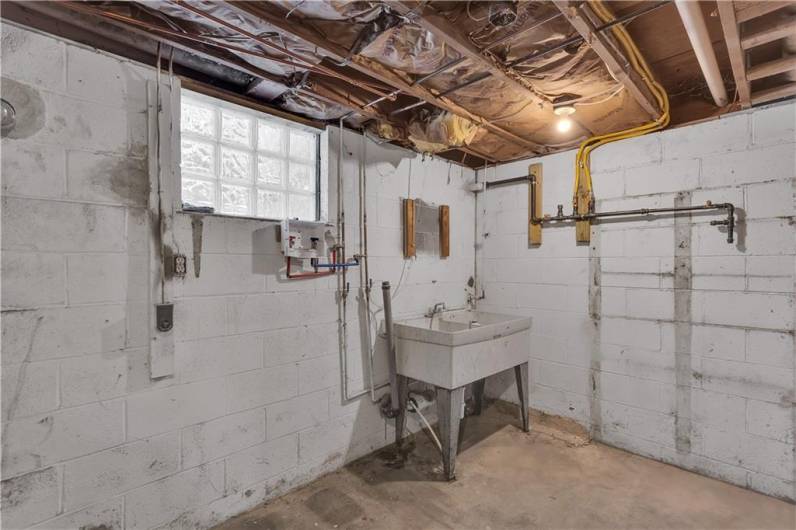 Convenient Laundry / Storage Room off Game Room with Utility Sink.